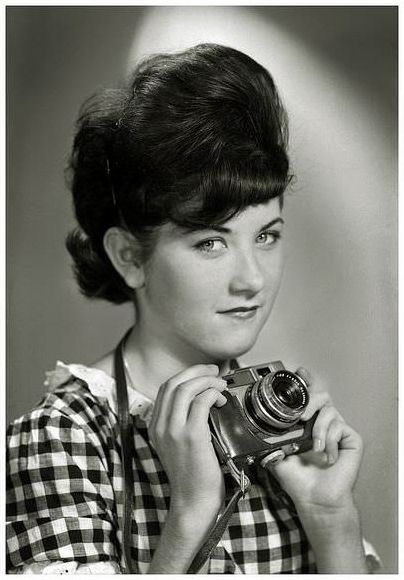 Maxine Sullivan, of Melbourne, Australia, with a Petri 35mm camera, and a typical teen coiffure during the 1960's.