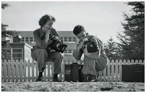 While undergoing training, United States military photographers practice with the Graflex camera during May, 1944.
