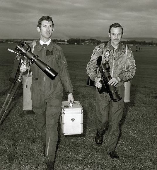 Cpl Adrian Lautenbach (Australian Army) and Sgt Al Meadows (Royal Australian Air Force), both Australian Defence Public Relations photographers, finish work at the RAAF base at Fairbairn, Canberra in March 1979.
