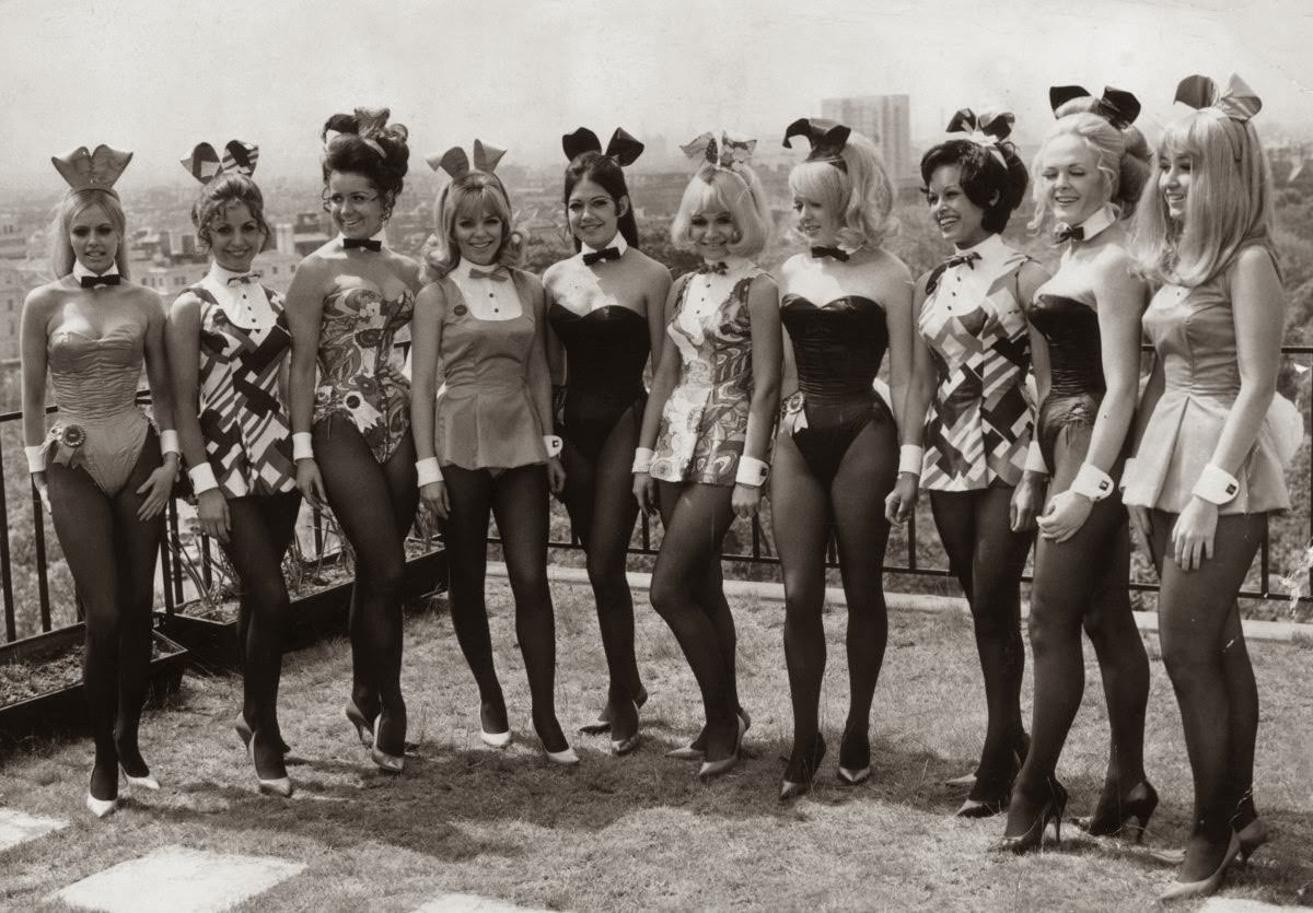 Bunny Girls in costume pose on the roof of the Playboy Club, London, 1976.