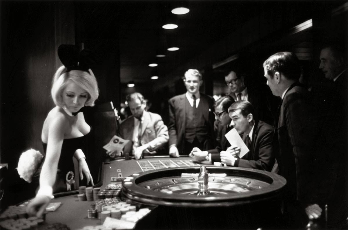 A bunny girl croupier at the Playboy club supervises a roulette wheel, 1967.