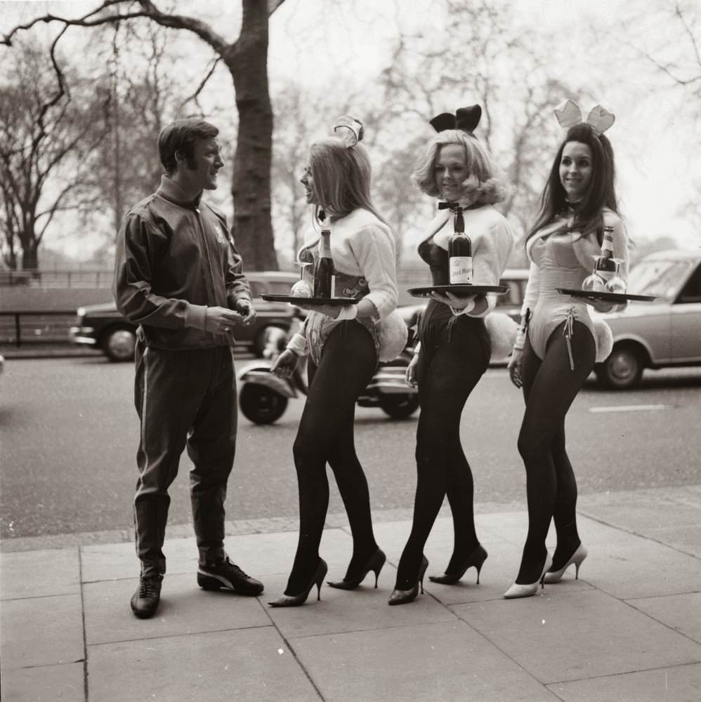 Three Playboy Club Bunny Girls practice their serving during a training session for the All-London Waiter and Waitress Race to be held for charity in Battersea Park, 1970.