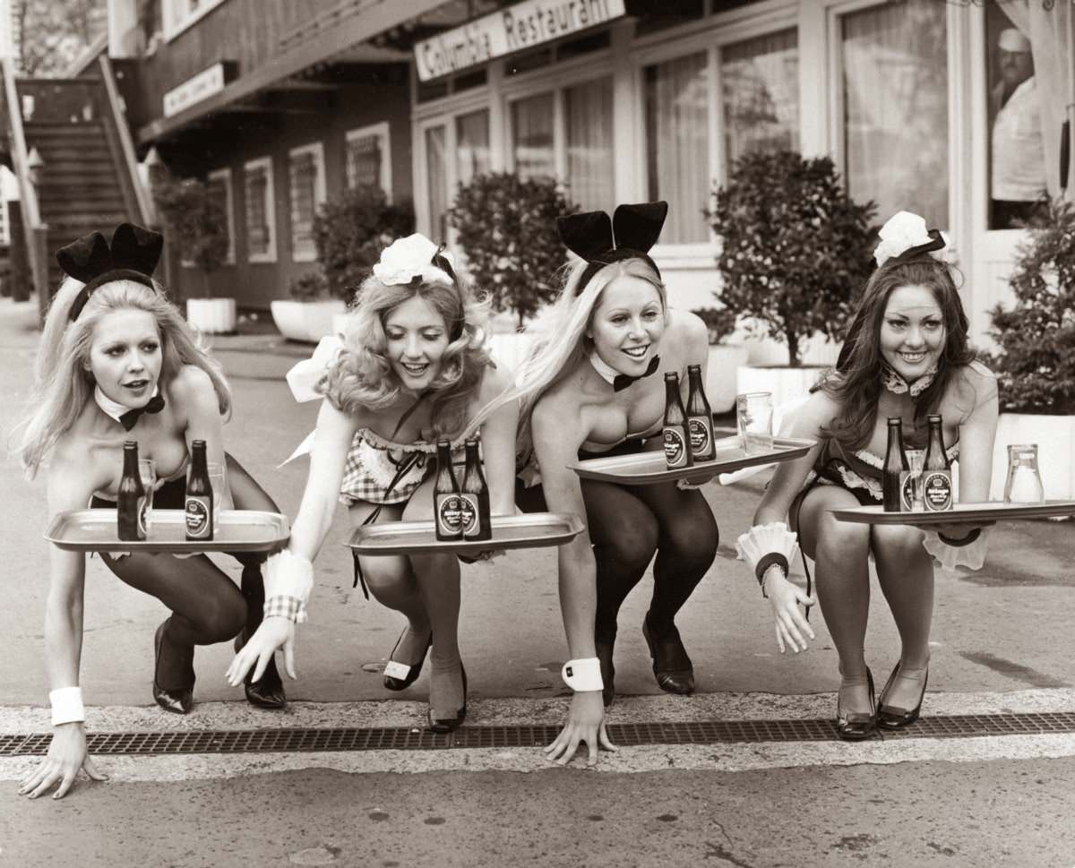 Two Bunny Girls from the Playboy Club and two Penthouse Pets from the Penthouse Club prepare to take part in the annual Good Friday waiters and waitresses race in Battersea Festival Gardens, London, 1972.