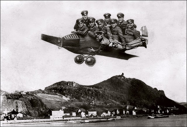 Overloaded car with the Rhine Valley at Königswinter, featuring the castle Drachenfels and Schloss Drachenburg in the background, Germany, circa 1930.