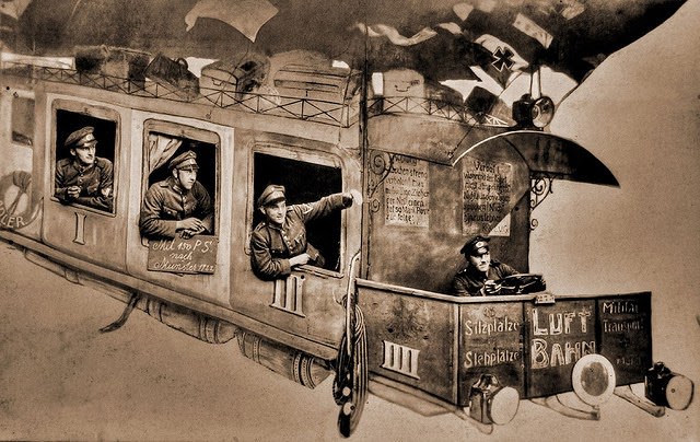 A humorous backdrop for photographs featuring a military zeppelin train, 1920s.