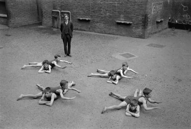 Fast forward to 1923, when schoolboys had to master their swimming strokes on dry land—and their buddies—before getting anywhere near the water.