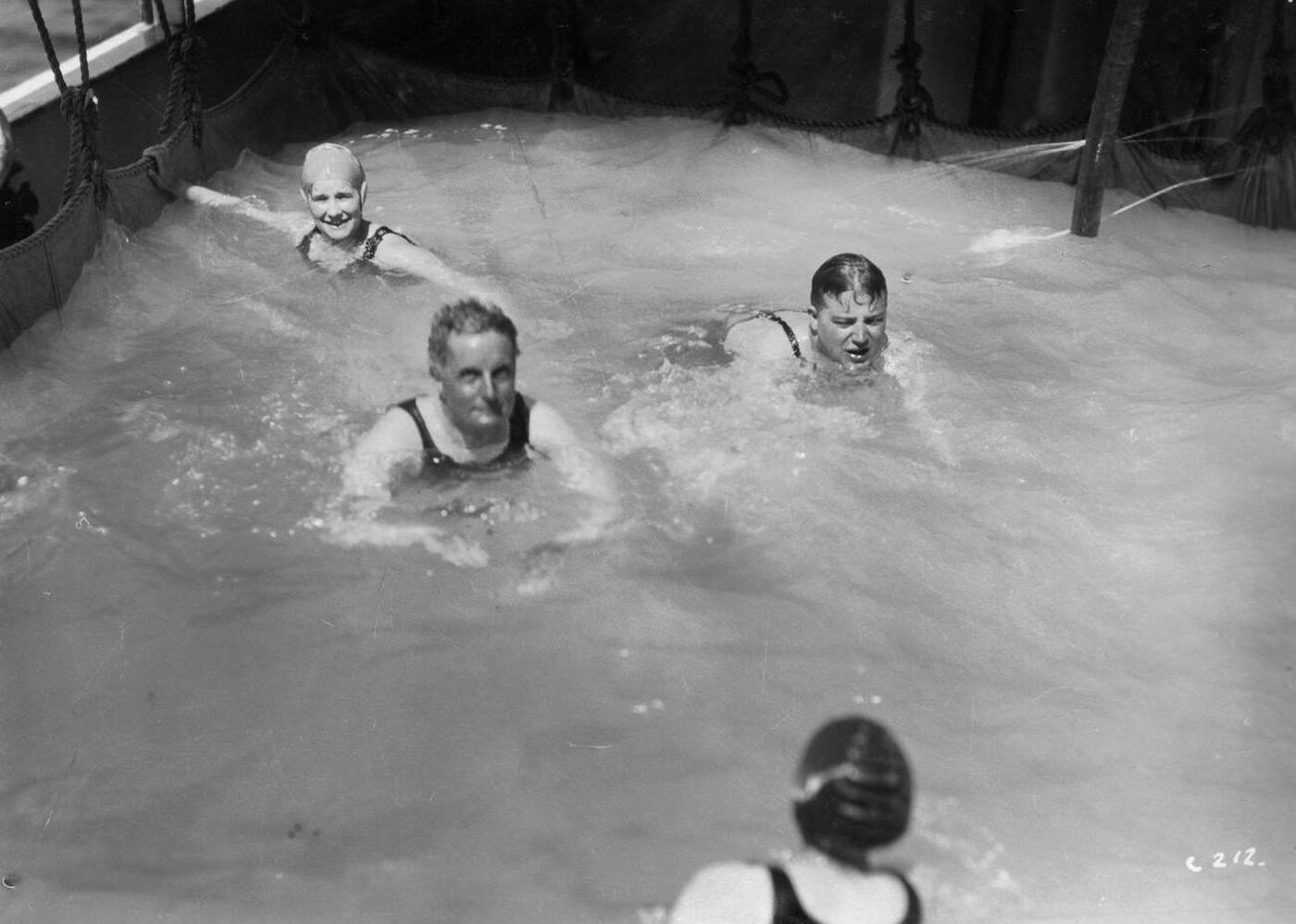 Passengers in the swimming pool on board a cruise ship, 1920s-1930s.