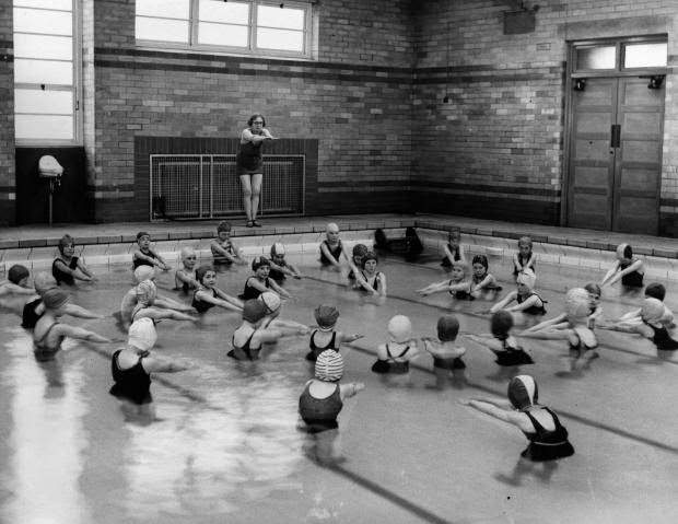 Students from Woodthorpe Council School celebrate their new pool taking a swimming lesson in February 1938.