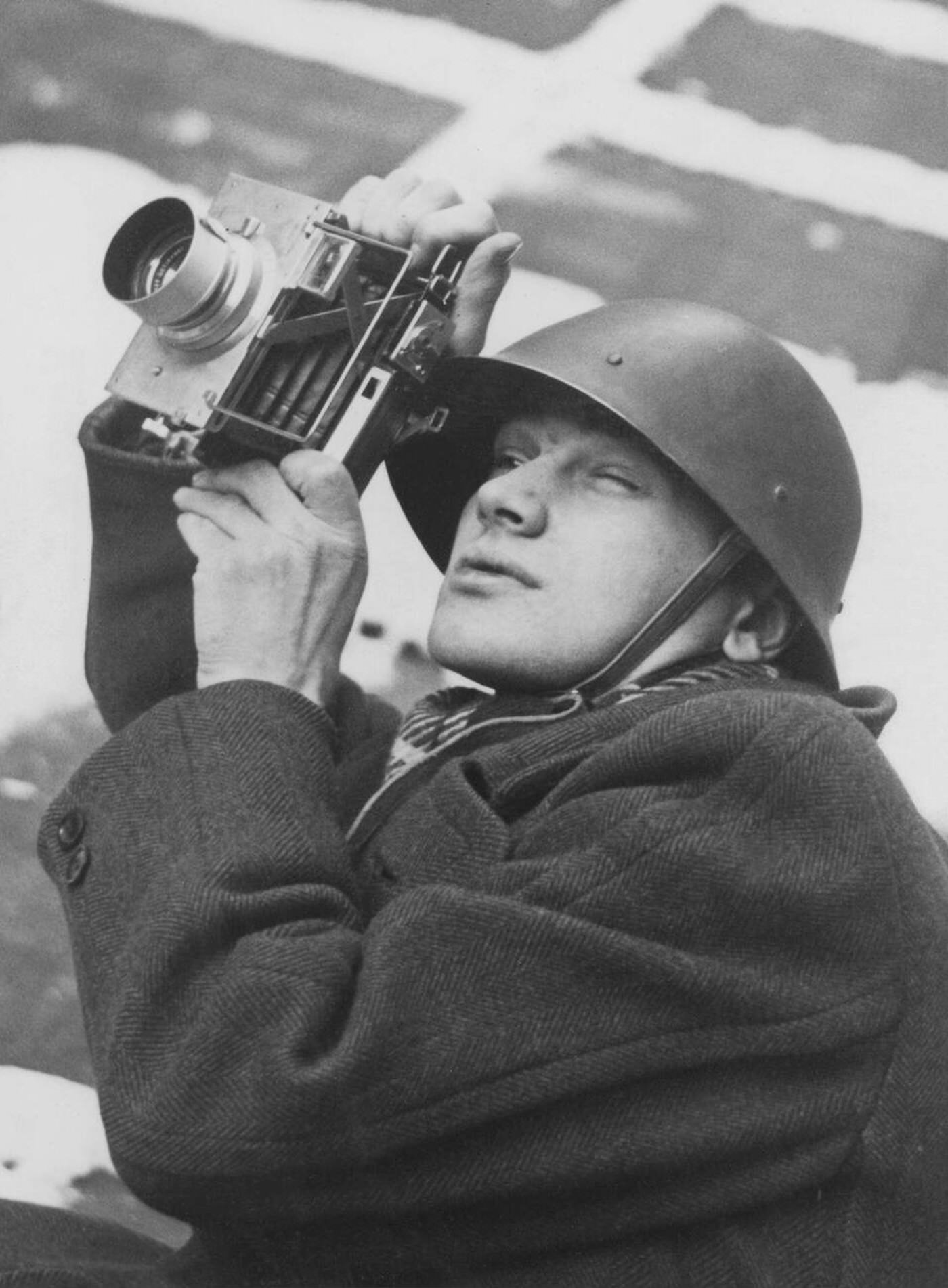 Karl Gustaf Kristoffersson, a Swedish press photographer who documented the Winter War in Finland, with camera, 1939.