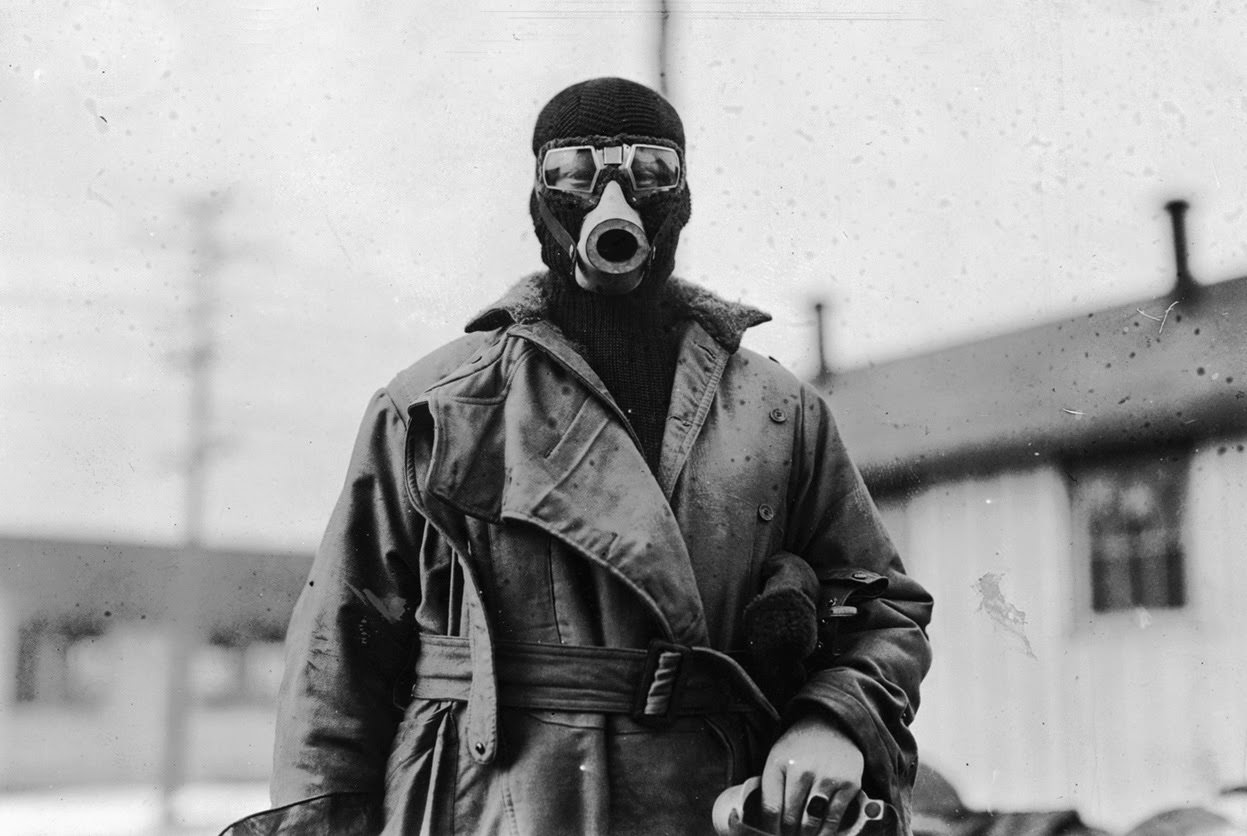 Unidentified pilot wearing a type of breathing apparatus, taken at Hazelhurst Field, Long Island, New York.
