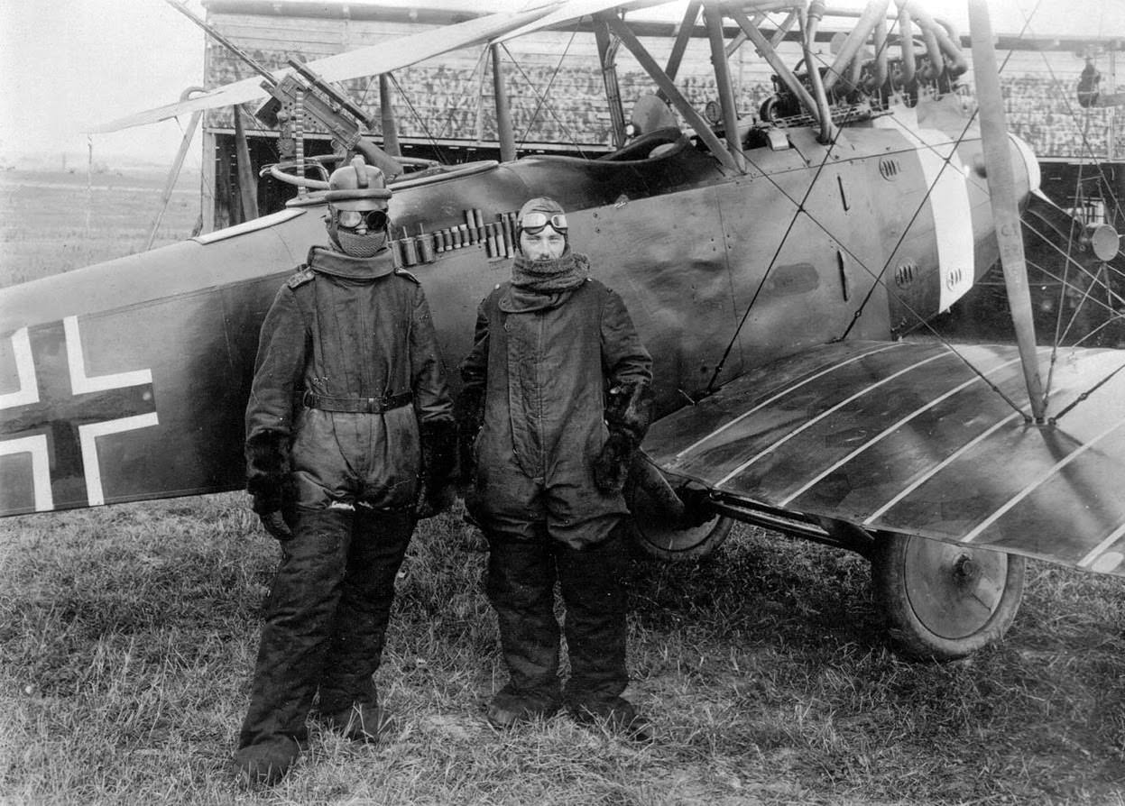 German pilot Richard Scholl and his co-pilot Lieutenant Anderer in flight gear beside their Hannover CL.II biplane, 1918.
