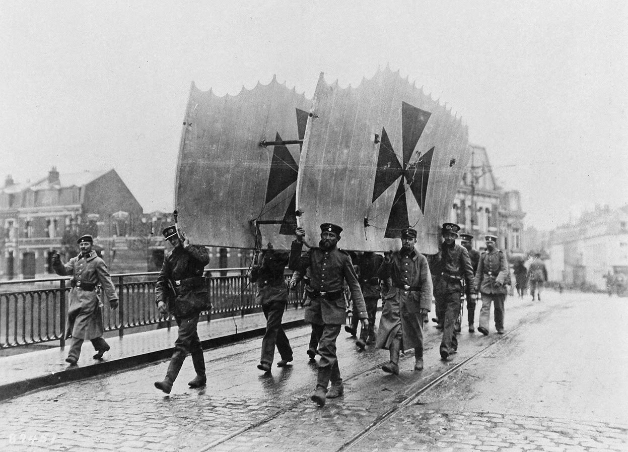 Soldiers carry a set of German airplane wings.