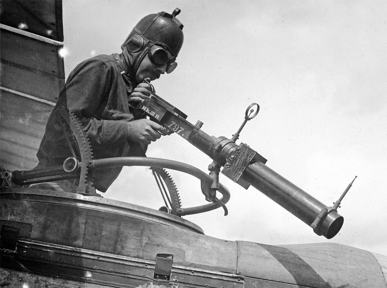 A soldier poses with a Hythe Mk III Gun Camera during training activities at Ellington Field, Houston, Texas; the Mk III was used to train aerial gunners, recording a photograph when the trigger was pulled, for later review, 1918.