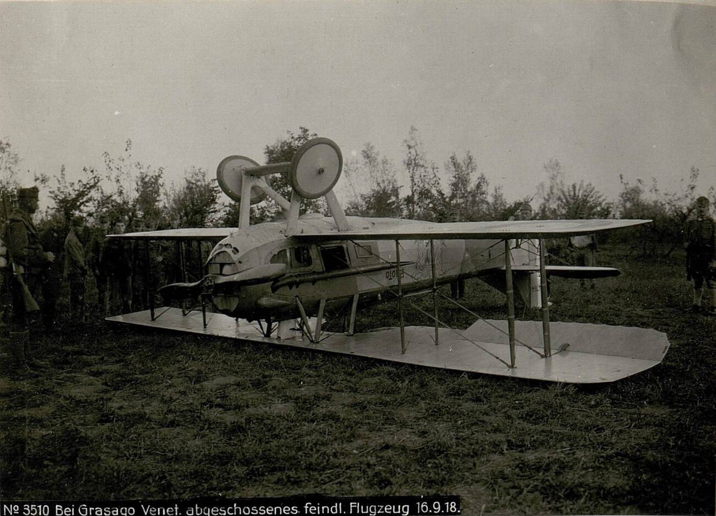 A downed enemy aircraft at Grasago, Italy, during World War I, 1918.