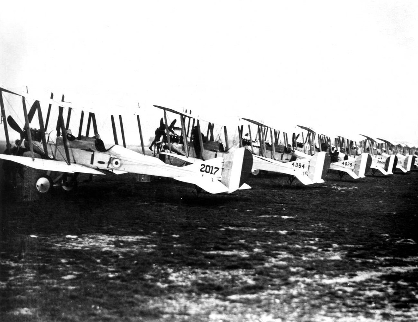 A line of BE2c planes of No.13 squadron at Gosport, Hampshire, England, waiting to take off for duty in France, 1915.