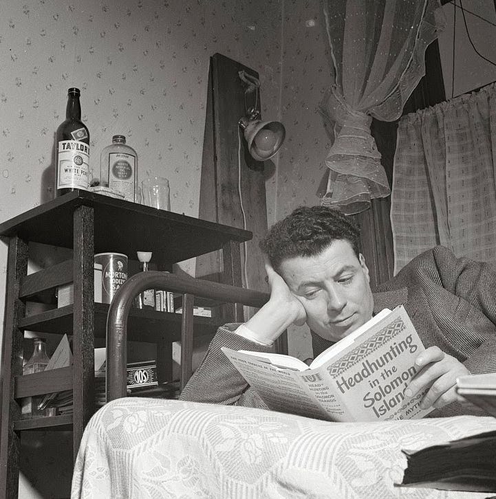 A clerk in the U.S. Navy Department reading in his room in a boardinghouse