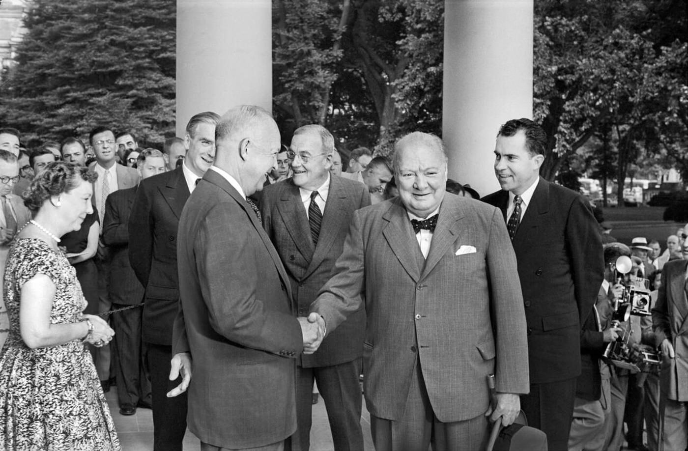 U.S. First Lady Mamie Eisenhower, U.S. President Dwight Eisenhower, U.S. Secretary of State John Foster Dulles, and U.S. Vice President Richard Nixon greeting British Prime Minister Winston Churchill and British Deputy Prime Minister Anthony Eden at the White House, Washington, D.C., 1954.