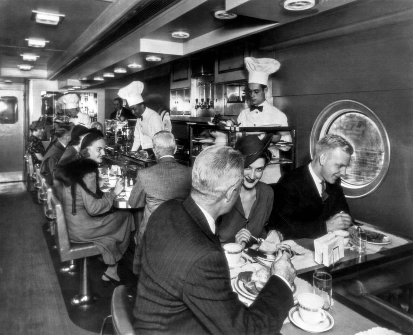 Passengers at the luncheon bar on one of the Pennsylvania Railroad's "Congressionals", the fast trains running between Washington and New York City, 1955.
