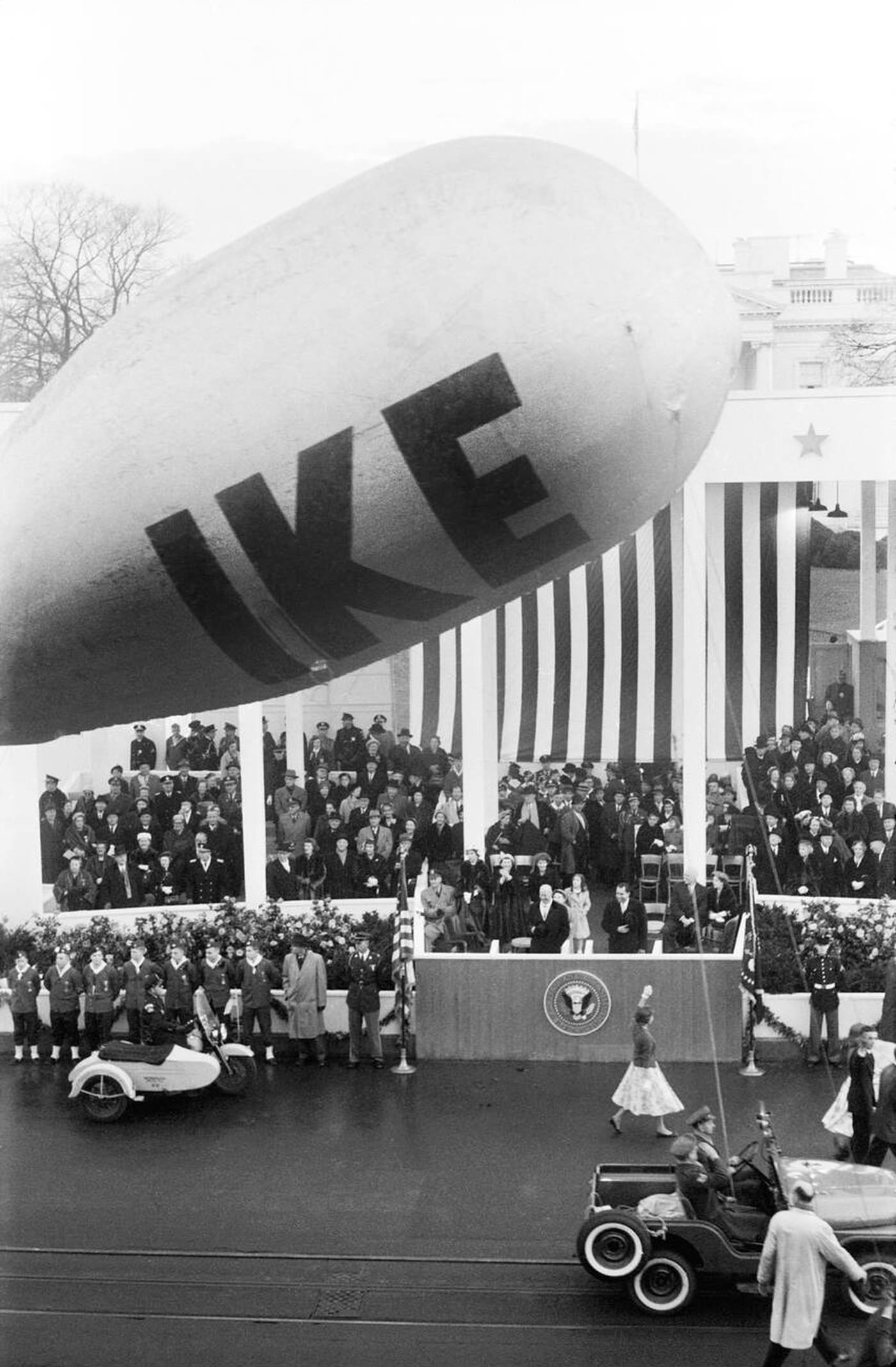 U.S. President Dwight Eisenhower and U.S. Vice President Richard Nixon Reviewing Inauguration Parade, with First Lady Mamie Eisenhower and Second Lady Pat Nixon seated behind, Washington, D.C., 1957.