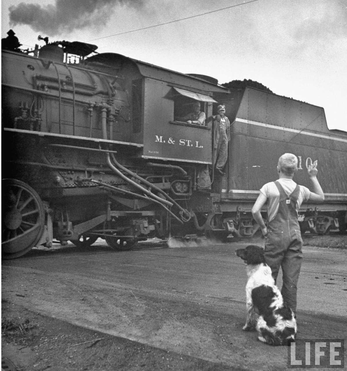 Holding on to Dunk, Larry waves at engineer.