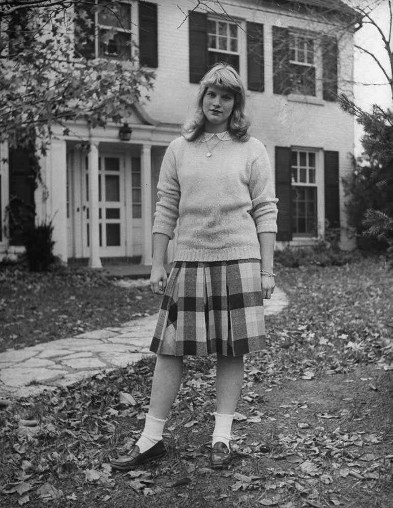The standard dress for school is a plain shetland sweater and a woolen skirt, 1940s