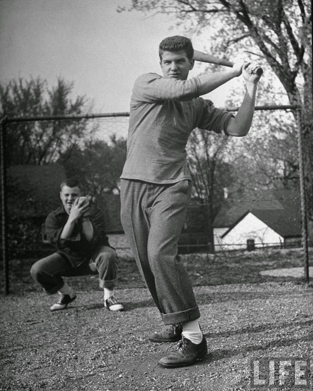 Next to girls, teen-age boys like sports, usual Saturday afternoon pasttime.