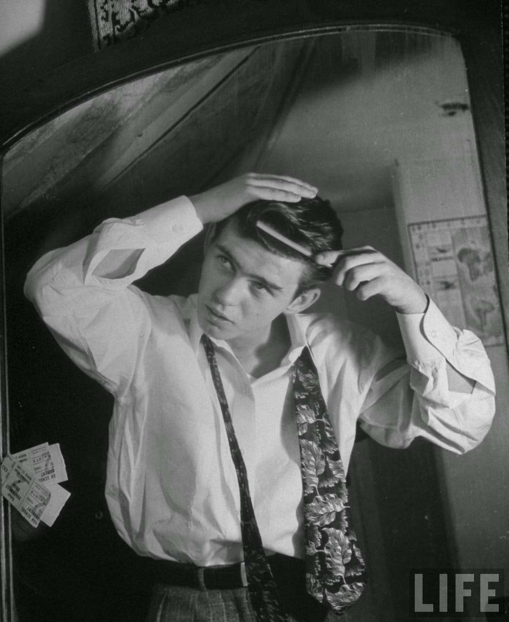 Boy combing his hair and puts in front wave, boys really like wavey hair but not curly hair.