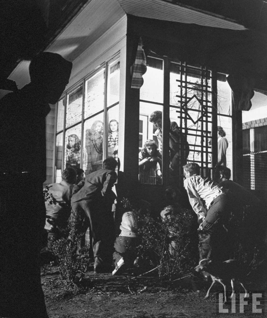 Boys heckling girls at a hen party.