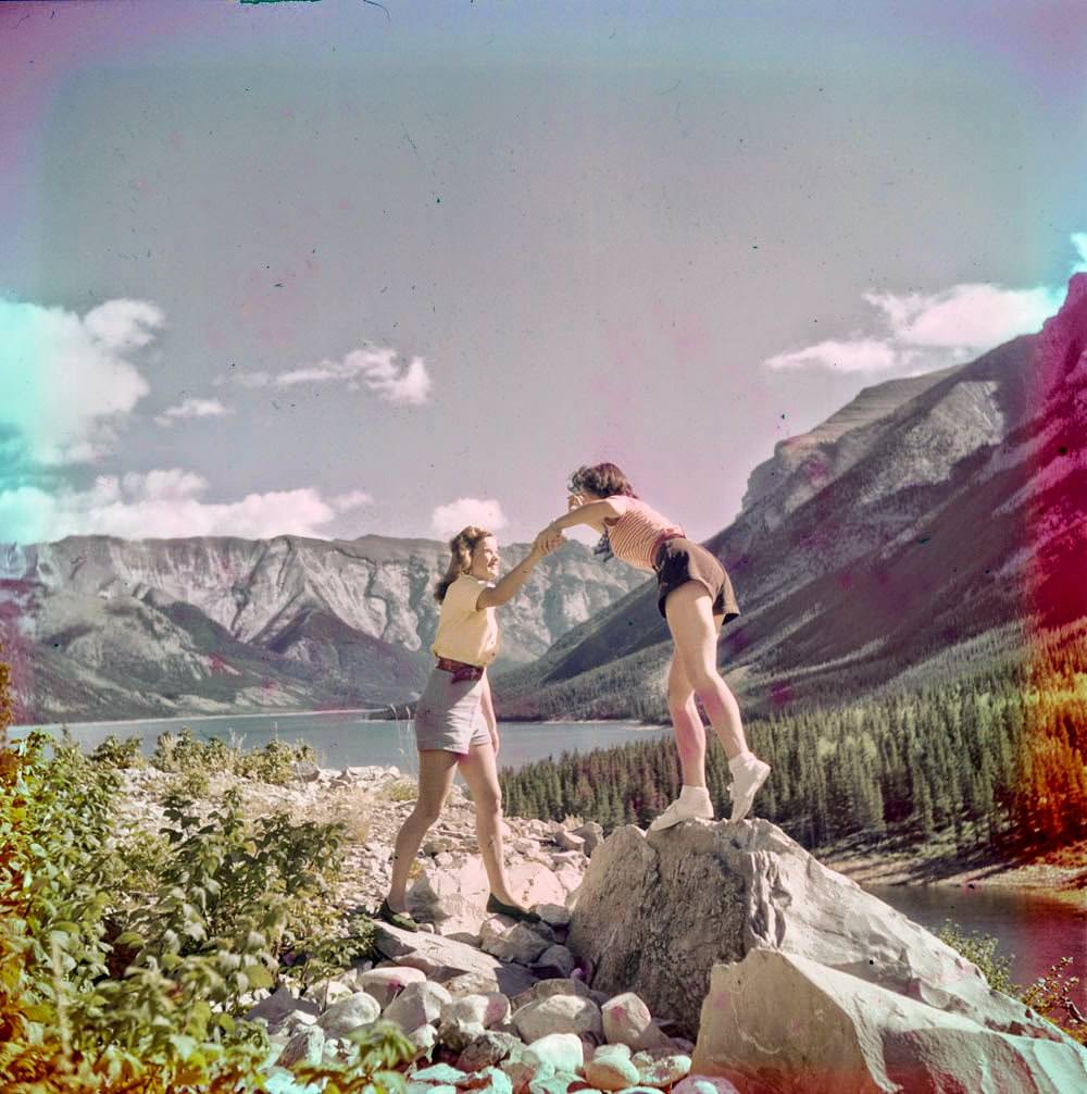 Women clambering over rocks near Morraine Lake, 1951.