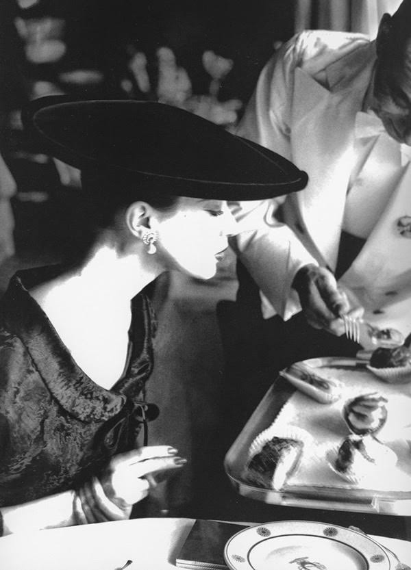 Wearing a Russian broadtail jacket by Pauline Trigère and hat by Lilly Dachè, 1955