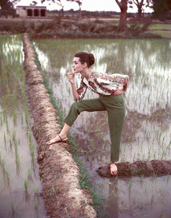 Barbara Mullen wearing a rose-printed cotton shirt by Digby Morton for Simpson and slacks in leaf-green linen by Daks, India, 1956