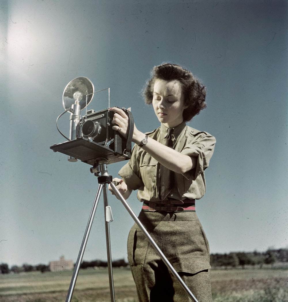 Sgt. Karen Hermiston, CWAC, with Speed Graphic camera from WWII