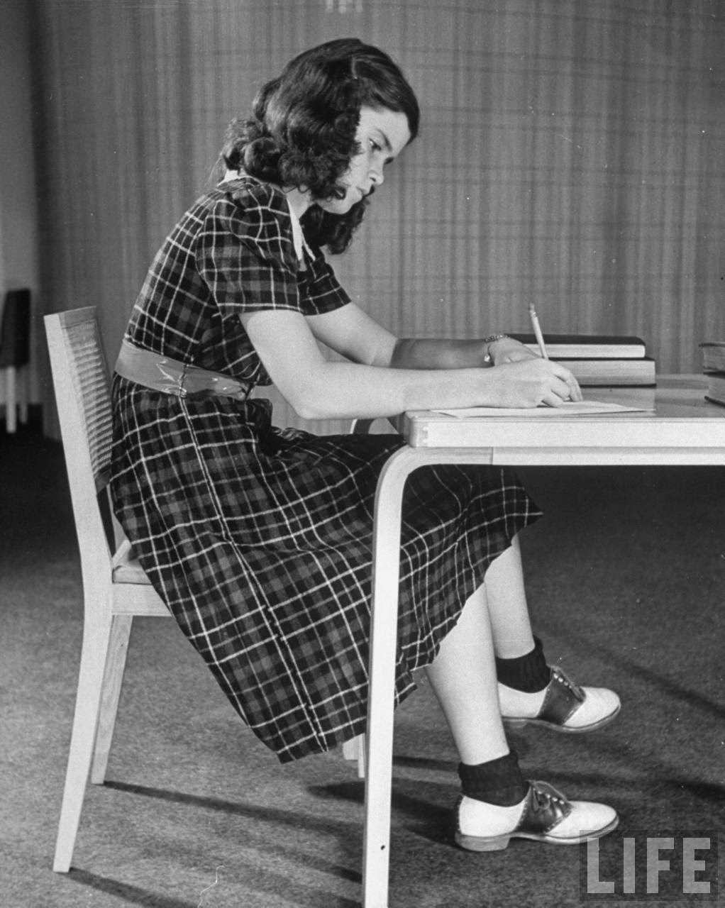 Plaid dress with pleated skirt for school. Saddle oxfords are the most popular shoe.