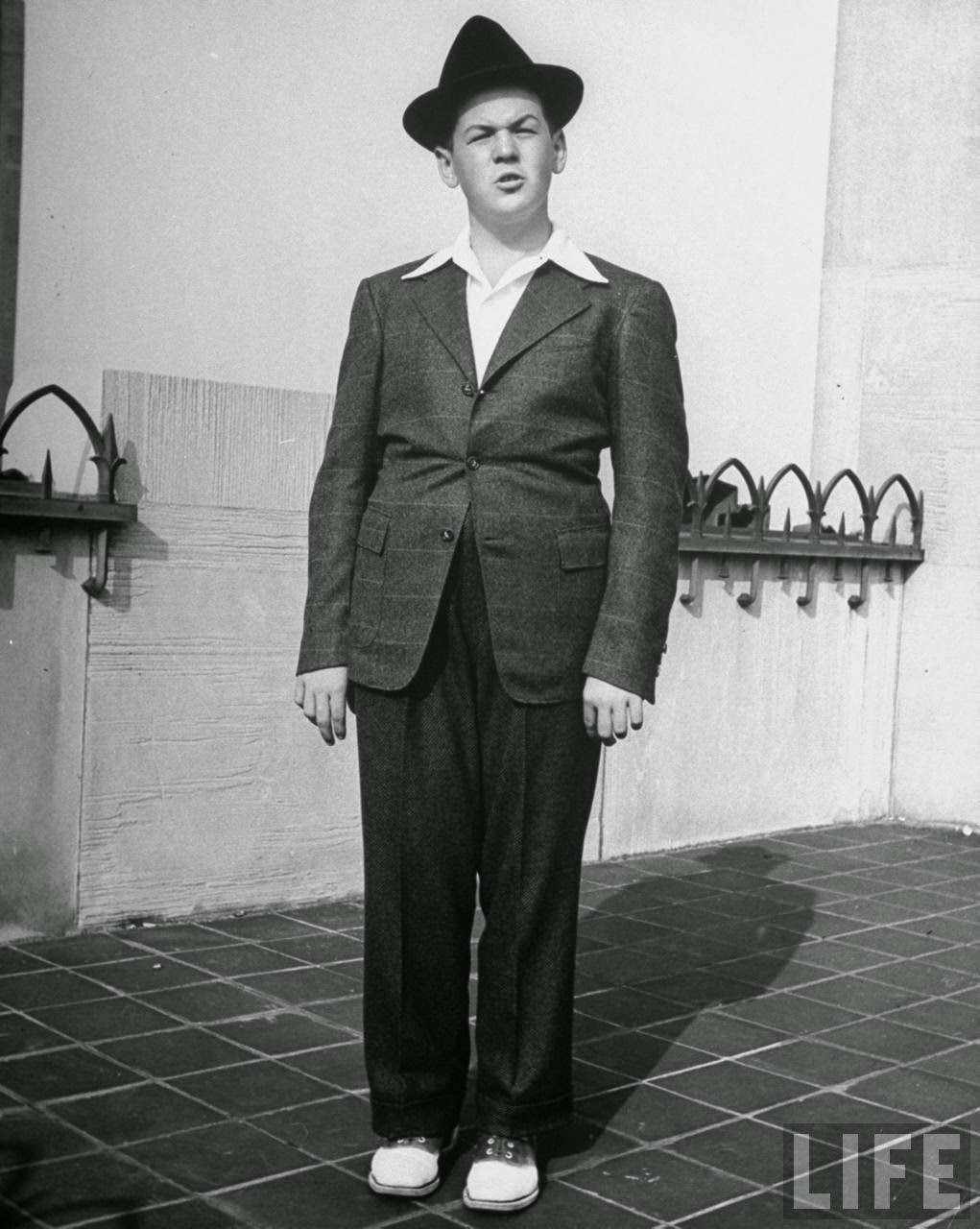 Snug fitting suit on a husky boy is likely to bind around middle, puff out at back and make boy look like a sausage.