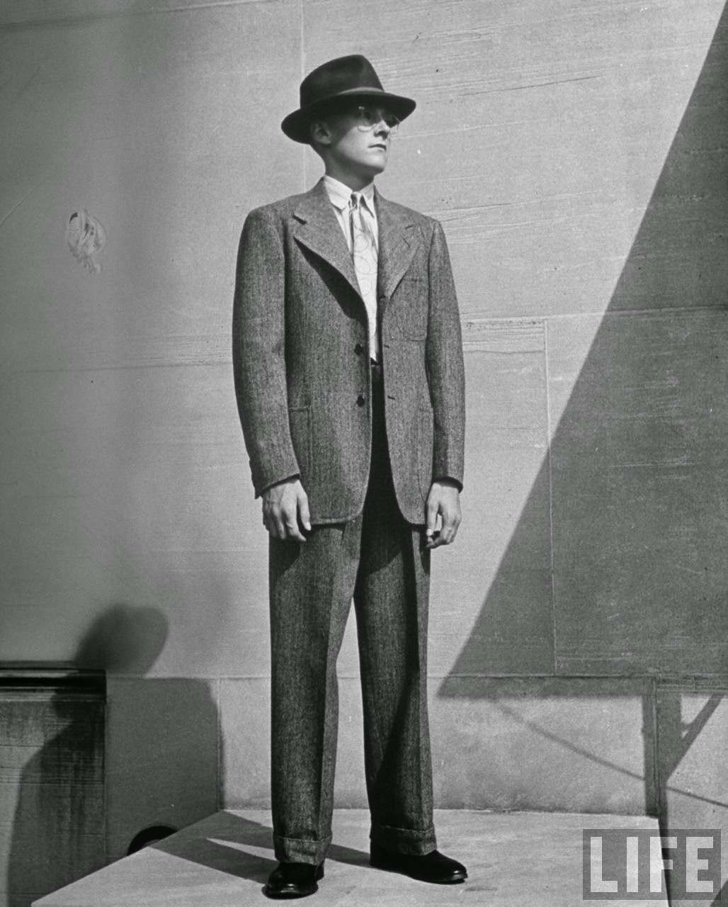 Single-breasted fitted jacket, a prep hat and inconspicuous glasses look right on youngster.