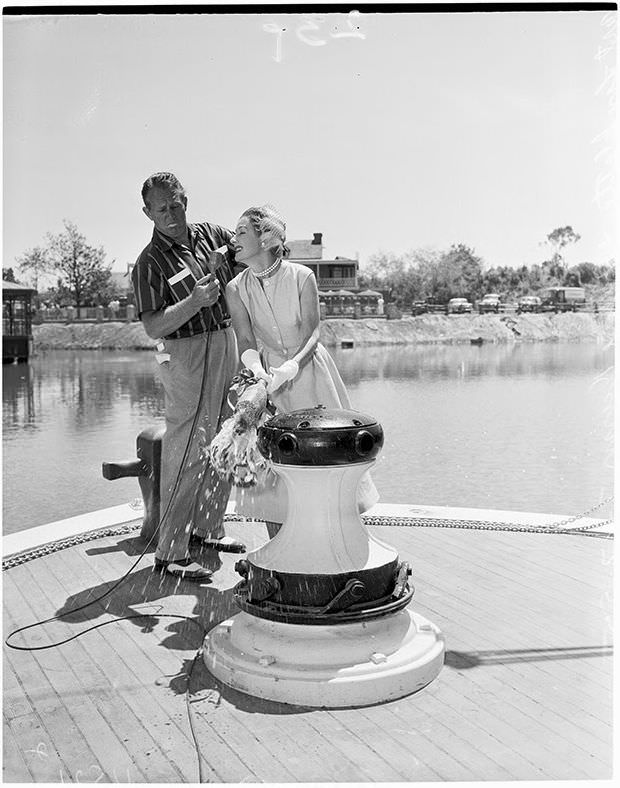 Irene Dunne and Art Linkletter christening the Mark Twain riverboat