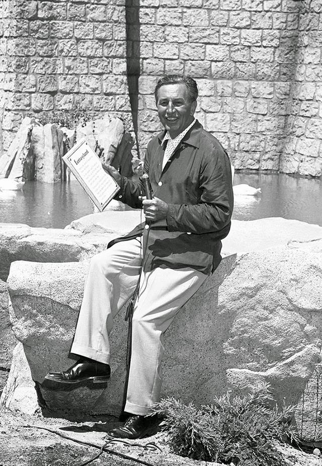 Walt Disney practicing for the Disneyland opening ceremony in front of Sleeping Beauty's Castle