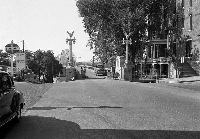 Bridge blocked off with signs indicating "Danger Water Over Highway," 1951