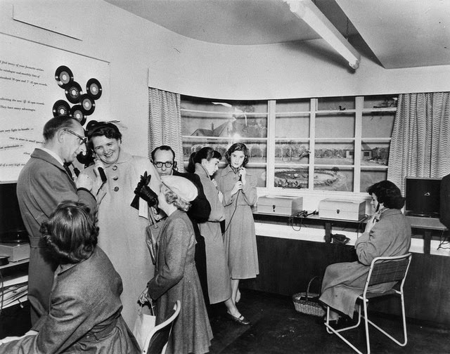 Customers at listening posts, late 1950s