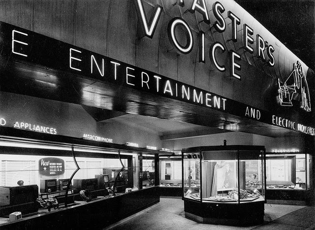 Store exterior at night, 1950s