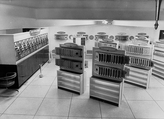 Bowsers and listening post in store, 1950s