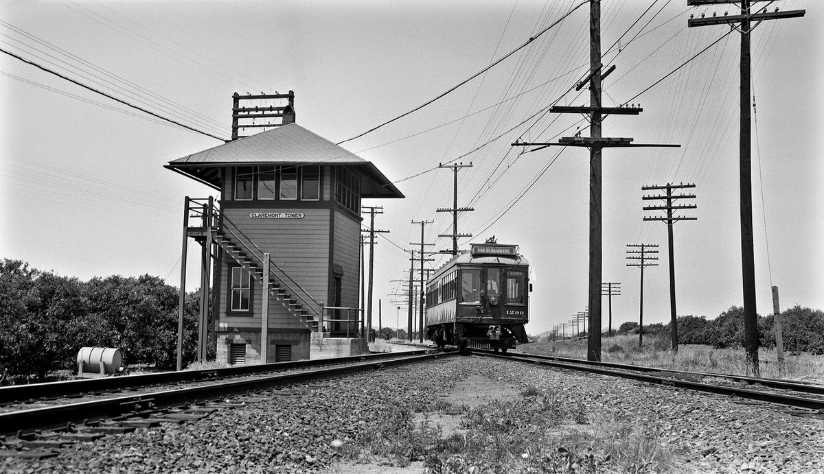 Pacific Electric no. 1299 rolls past Claremont Tower, 1951