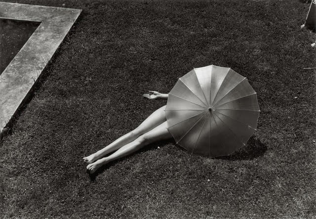 Girl hiding under umbrella, 1935