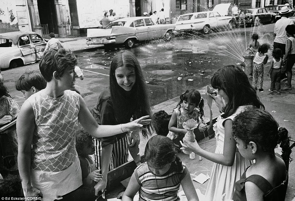 Girls play in the street and sidewalks during a block party in New York during the summer of 1970