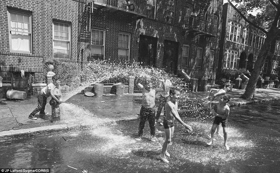 The long, hot summer of 1971 meant children cooled off with a water hydrant - now a classic New York summer scene