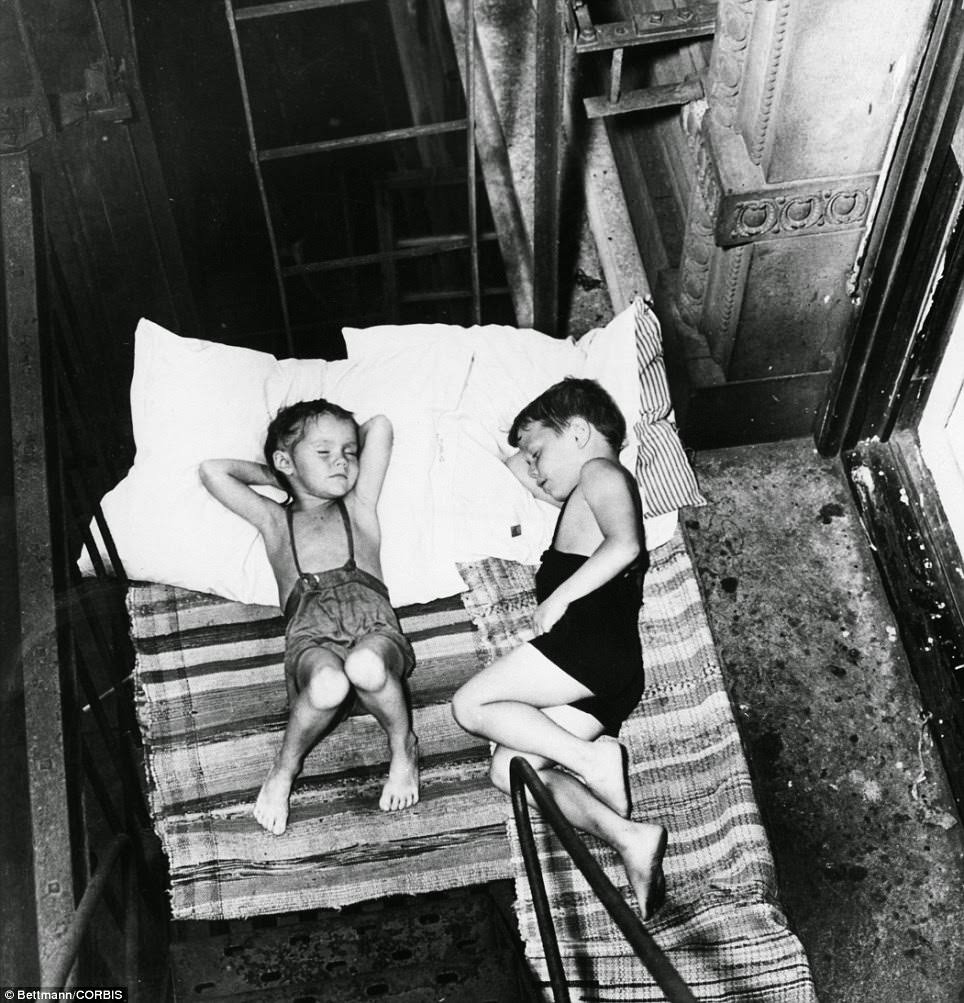 During summer months, the Lower East Side's tenement buildings' tiny rooms became so stifling that many children and tenement dwellers would sleep on the roof, or more frequently, on accessible fire escapes