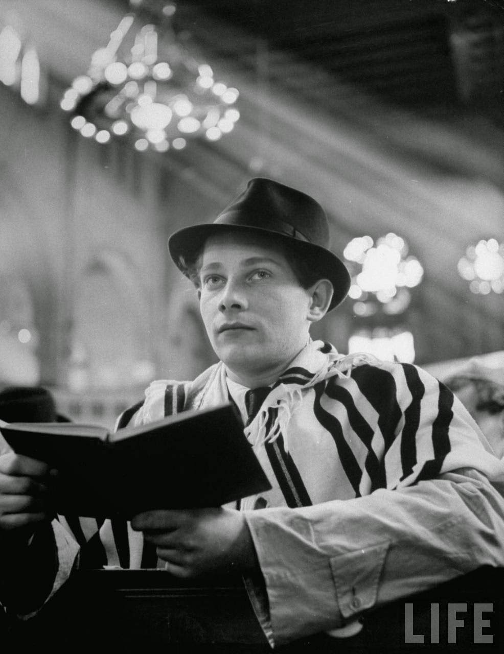 Gunter Ruschin praying at the synagogue during Passover.