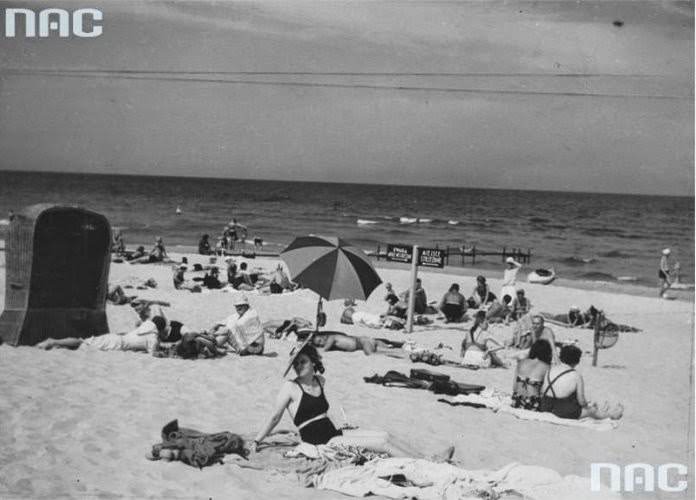 Sunbathers rest on the beach, August 1938.
