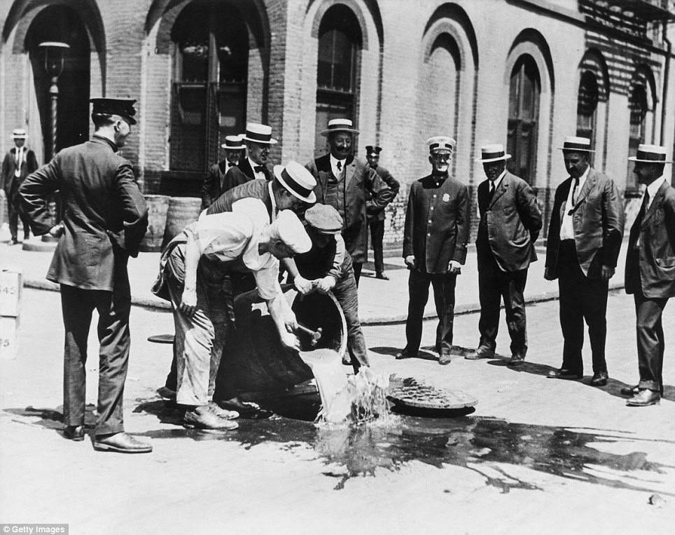 Alcohol is poured into a New York sewer in about 1920