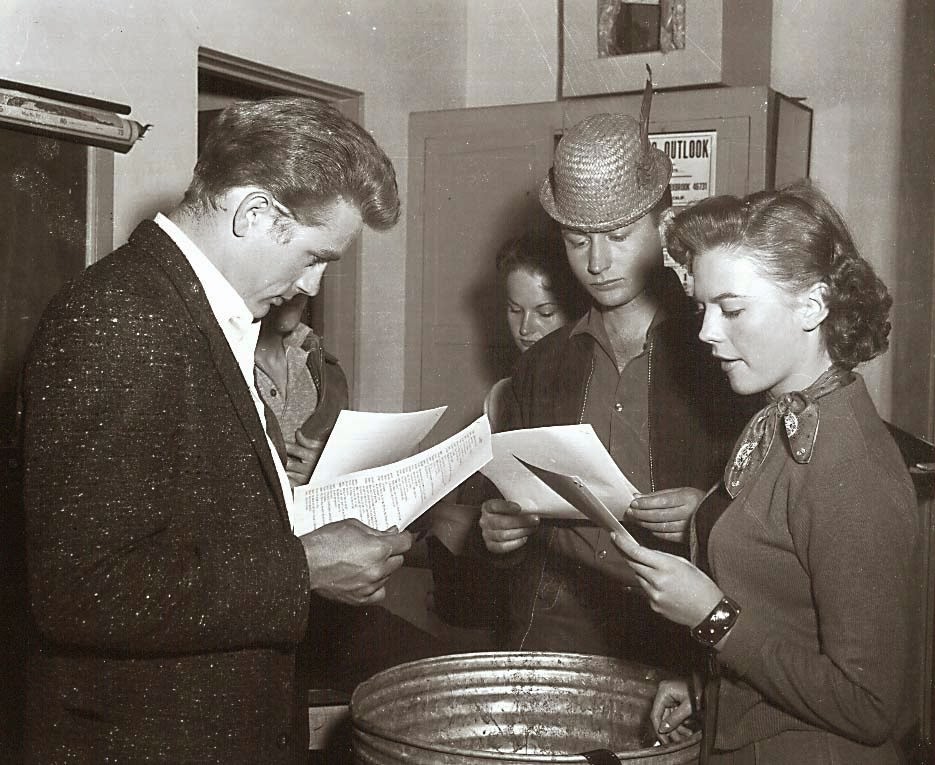 James Dean, Nick Adams and Natalie Wood going over their scripts for Rebel without A Cause.